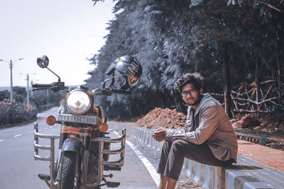 People riding motorcycle on road