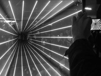 Low angle view of people at illuminated nightclub