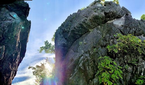 Low angle view of rock formation against sky