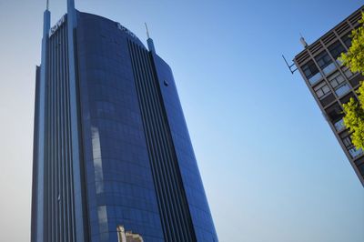 Low angle view of modern building against clear sky