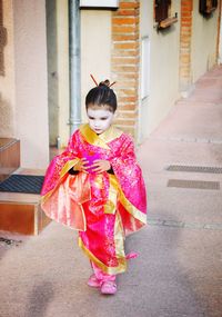 Geisha girl walking on street