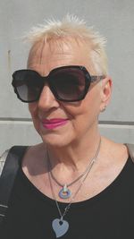 Blond grandmother model portrait of woman wearing sunglasses