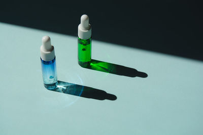 Liquid face serum in a glass bottles with a dropper. essence of skin care for health and beauty.