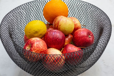 High angle view of apples in basket on table