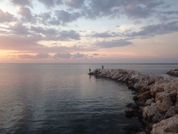 Scenic view of sea against sky during sunset