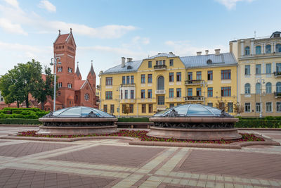 Buildings in city against sky