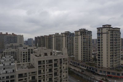 High angle view of buildings in city against sky