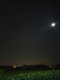 Scenic view of field against sky at night