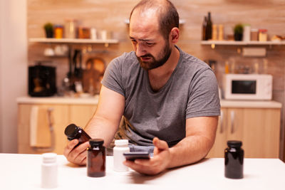 Young man using remote control