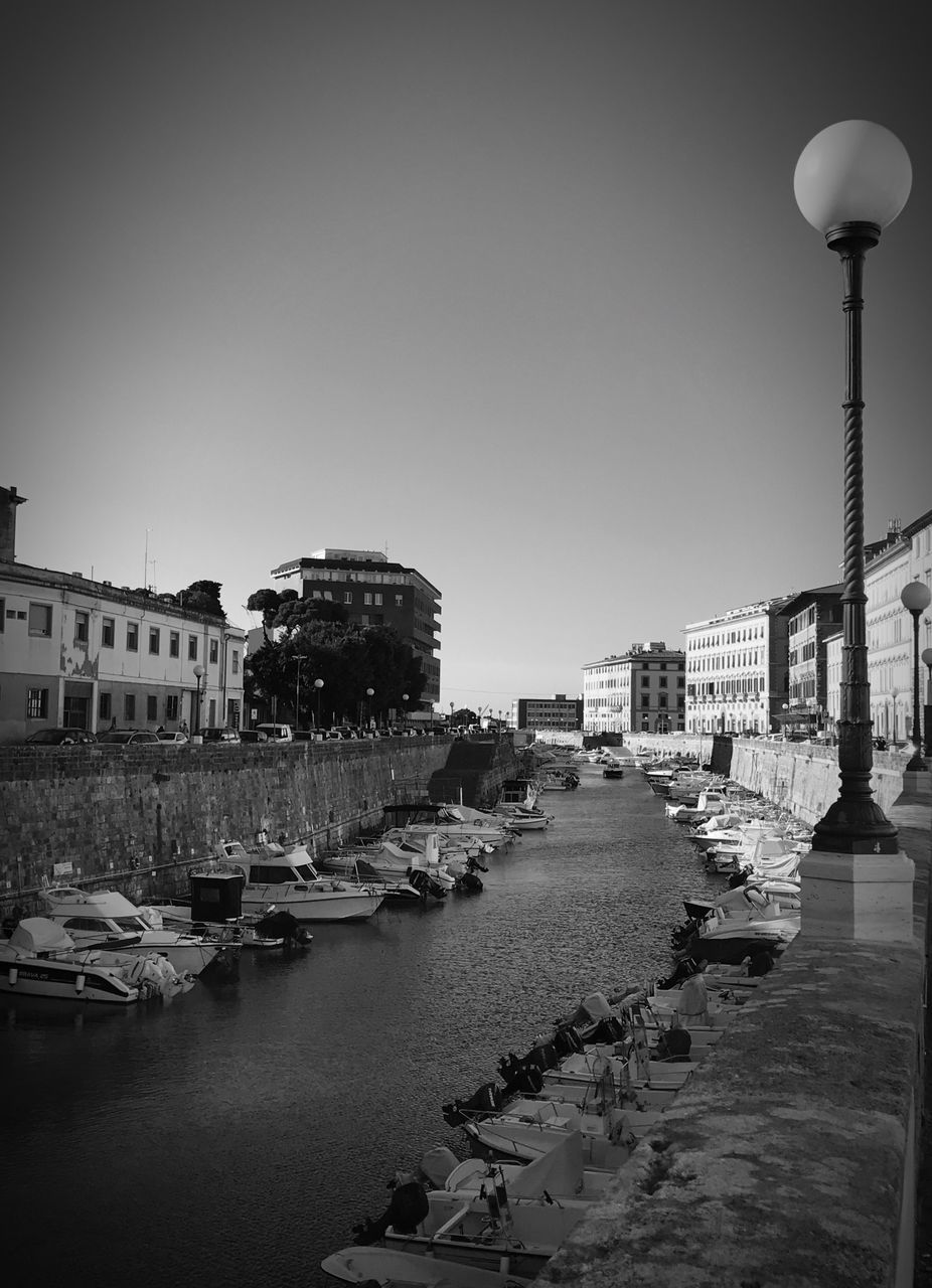 building exterior, architecture, built structure, city, water, clear sky, travel destinations, sky, outdoors, day, no people