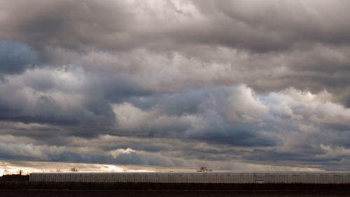 Scenic view of storm clouds over dramatic sky