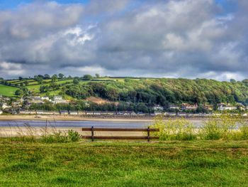 Scenic view of landscape against cloudy sky