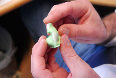 Close-up of hand holding ice cream