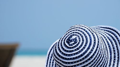 White blue striped hat at beach