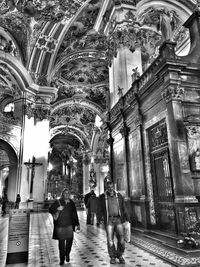 People in front of built structure