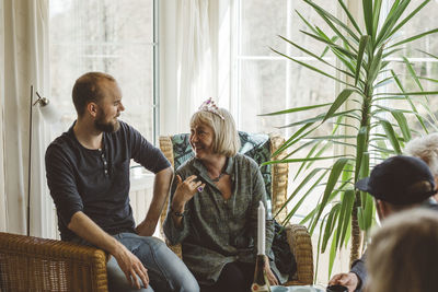 Man and woman talking in living room