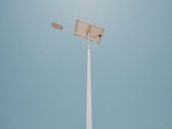 Low angle view of street light against clear blue sky