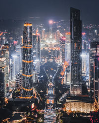 Aerial view of illuminated buildings in city at night