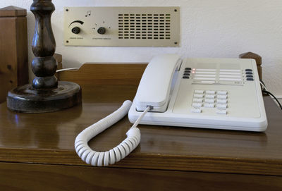 Close-up of telephone on table