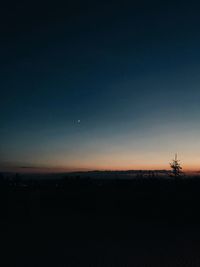 Scenic view of silhouette landscape against clear sky at night