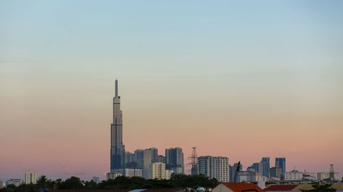 View of landmark 81 and other houses in ho chi minh city on sunset, vietnam