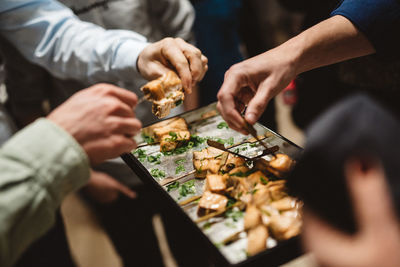 People holding hands on table