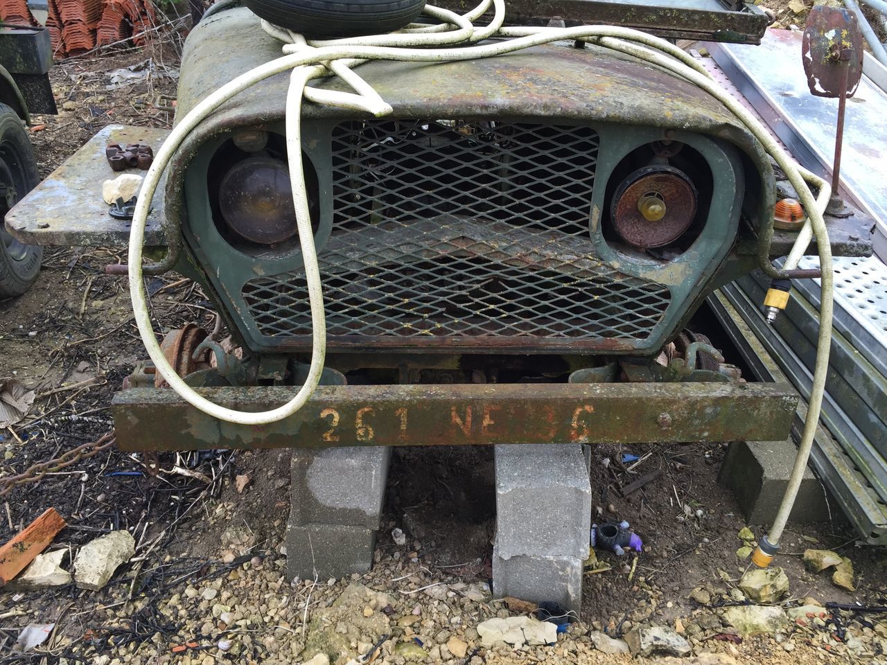 transportation, mode of transport, abandoned, metal, land vehicle, rusty, high angle view, obsolete, tire, old, wheel, day, outdoors, damaged, metallic, stationary, car, run-down, deterioration, no people