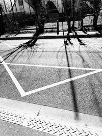 High angle view of road by trees in city