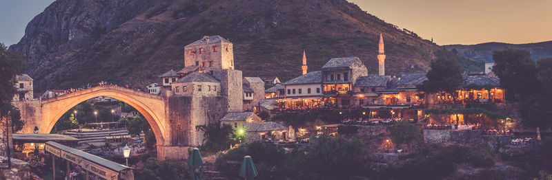 Illuminated buildings against the sky