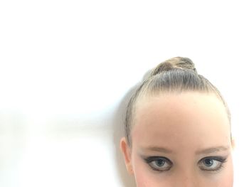 Close-up portrait of a young woman over white background