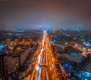 High angle view of illuminated cityscape at night