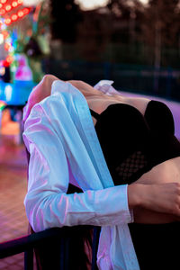 Rear view of couple holding hands