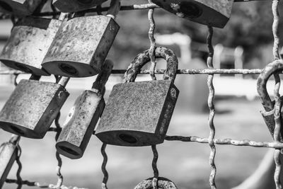 Close-up of padlocks attached to railing