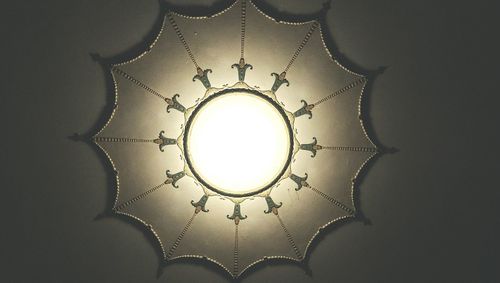 Low angle view of chandelier hanging from ceiling