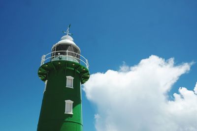 Low angle view of lighthouse against blue sky
