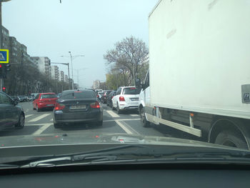 Cars on road in city