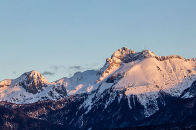 Scenic view of snowcapped mountains against clear sky