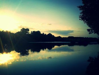 Scenic view of lake at sunset