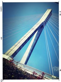 Low angle view of bridge against blue sky