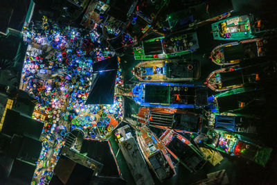 High angle view of illuminated buildings in city at night