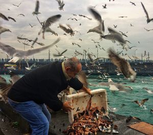 Full length of man eating fish in sea