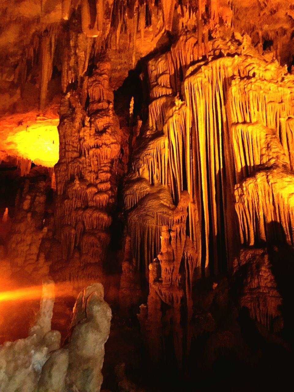 LOW ANGLE VIEW OF ROCK FORMATIONS AT CAVE