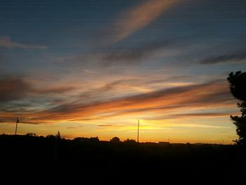 Silhouette of landscape against dramatic sky