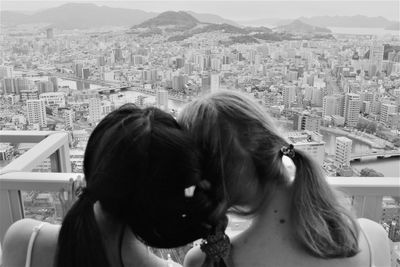 Portrait of woman with city in background