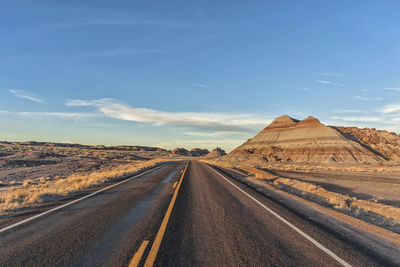 Empty road against sky