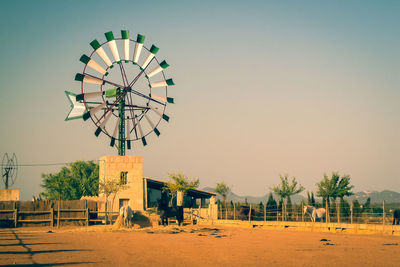 Traditional windmill against clear sky