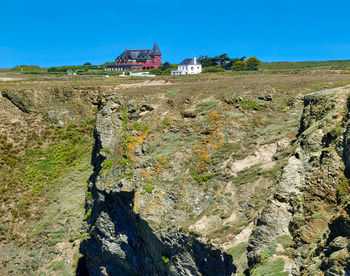 Scenic view of old building against blue sky