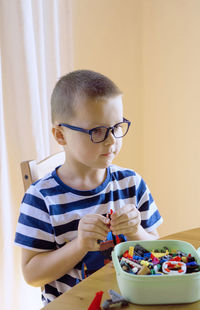 Portrait of boy on table