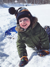Low angle view of woman skiing on snow
