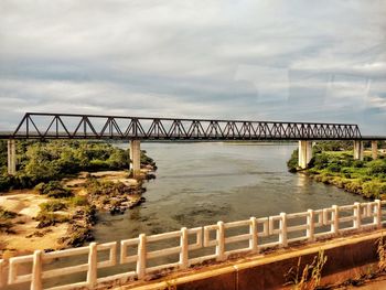 Bridge over river against sky